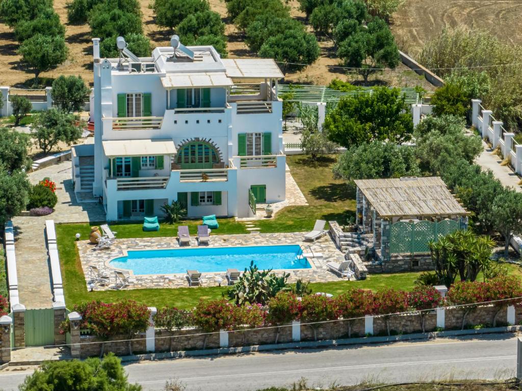an aerial view of a house with a swimming pool at JKG OIKIA in Agia Anna Naxos