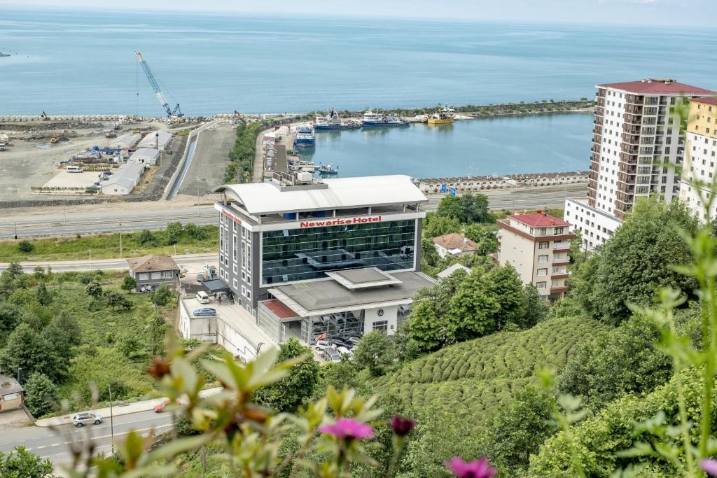 a view of a building and a body of water at Newarise Hotel in Rize