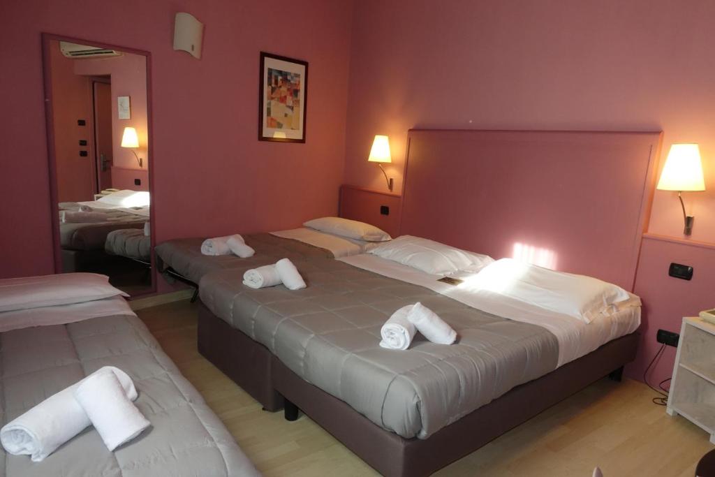 Postel nebo postele na pokoji v ubytování Hotel Corallo Rimini