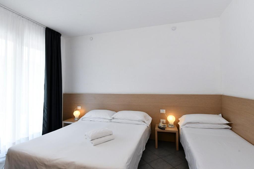 Postel nebo postele na pokoji v ubytování Hotel Eden