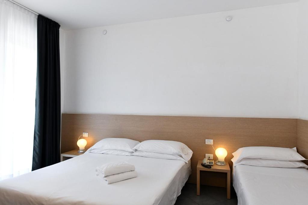 Postel nebo postele na pokoji v ubytování Hotel Eden