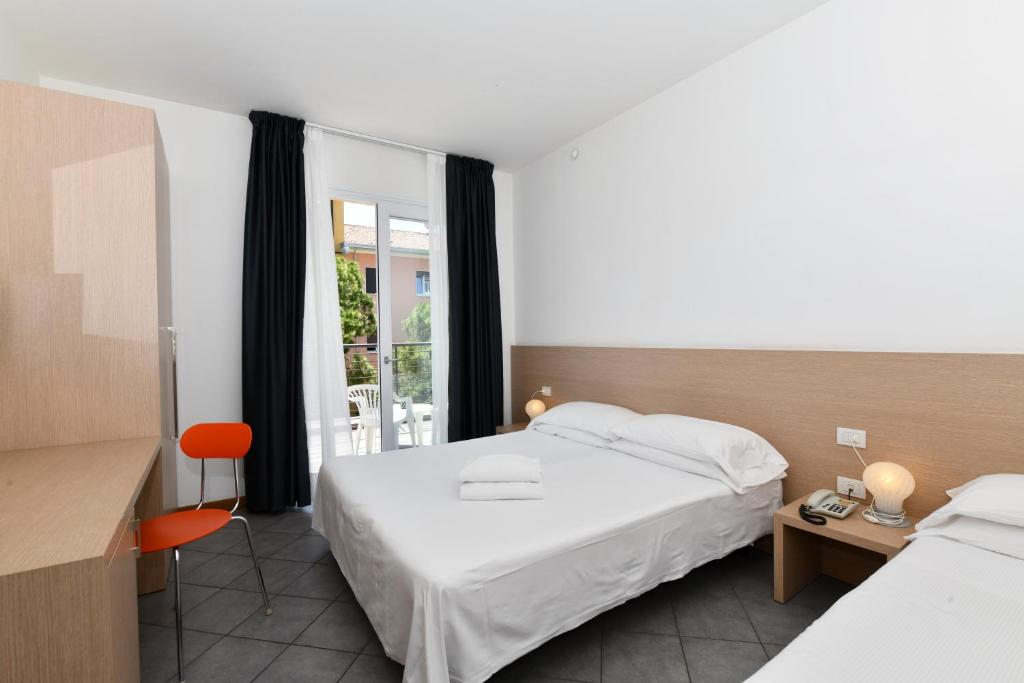 Postel nebo postele na pokoji v ubytování Hotel Eden