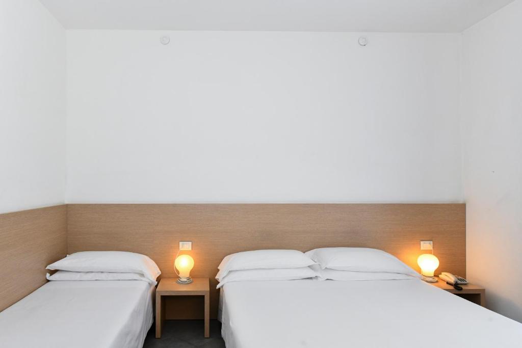 Postel nebo postele na pokoji v ubytování Hotel Eden