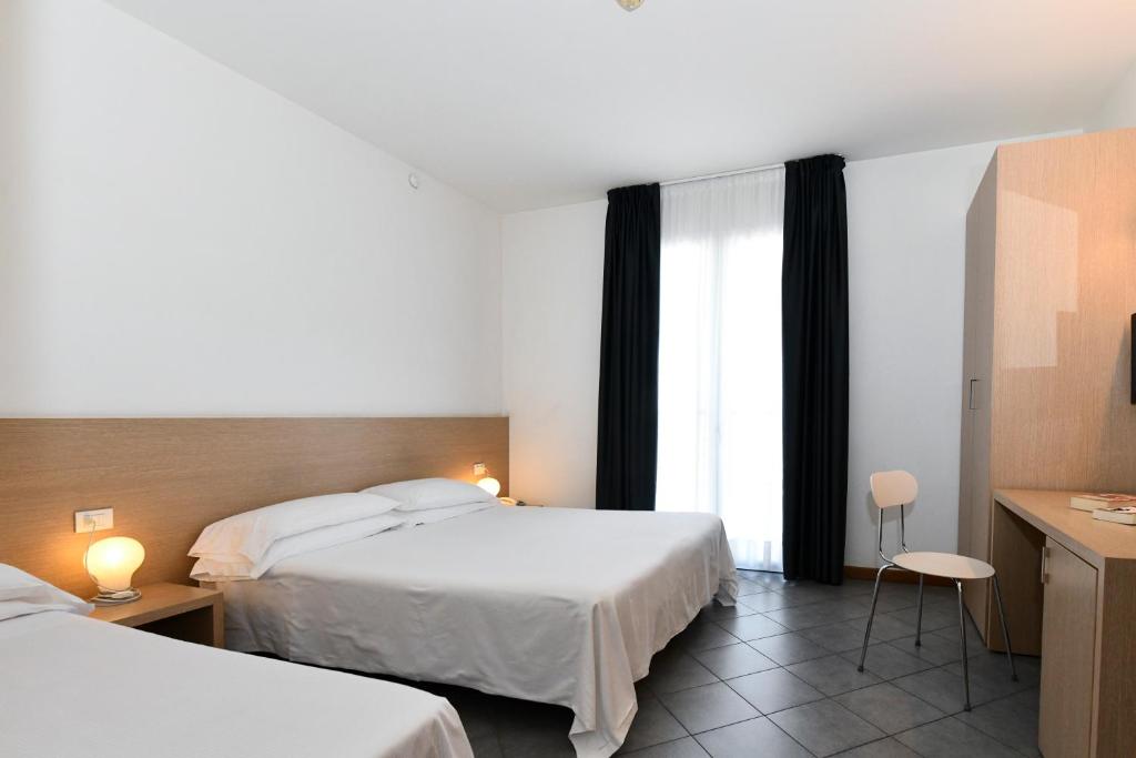 Postel nebo postele na pokoji v ubytování Hotel Eden