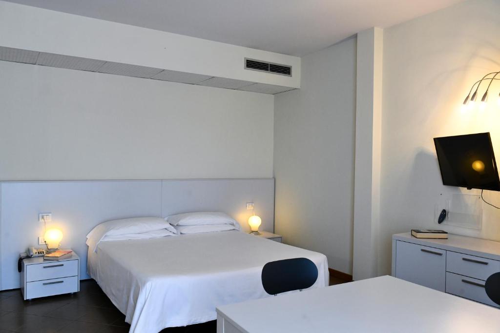 Postel nebo postele na pokoji v ubytování Hotel Eden