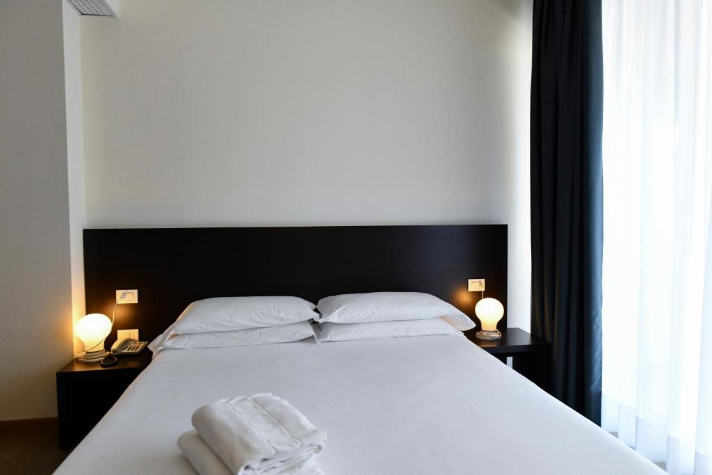 Postel nebo postele na pokoji v ubytování Hotel Eden