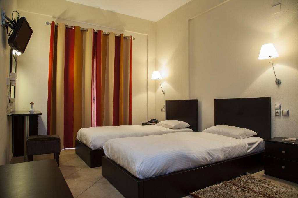 Postel nebo postele na pokoji v ubytování Hotel Meteoritis