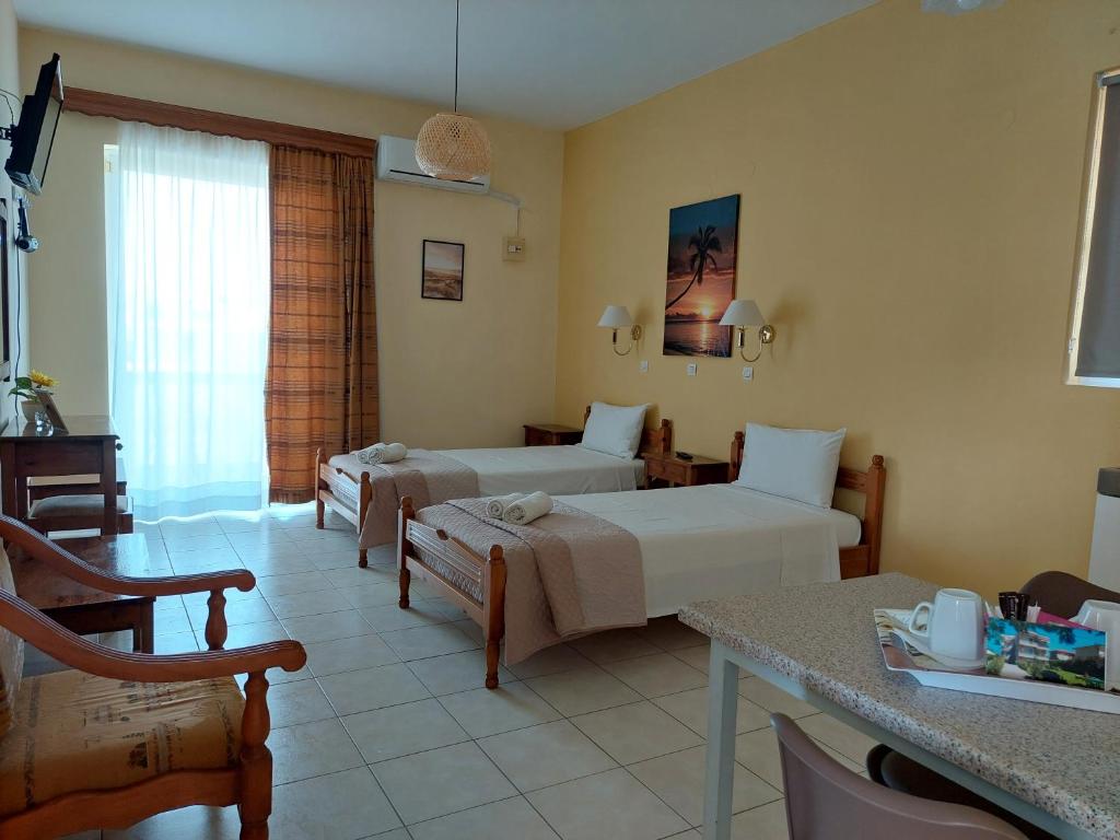 Postel nebo postele na pokoji v ubytování Alexia Apartments & Studios