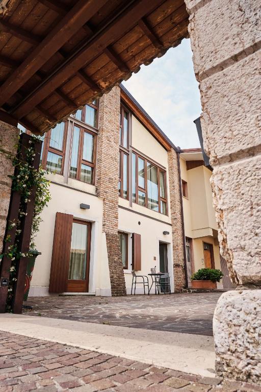 an outside view of a building with a patio at Ad Sidera in Pastrengo