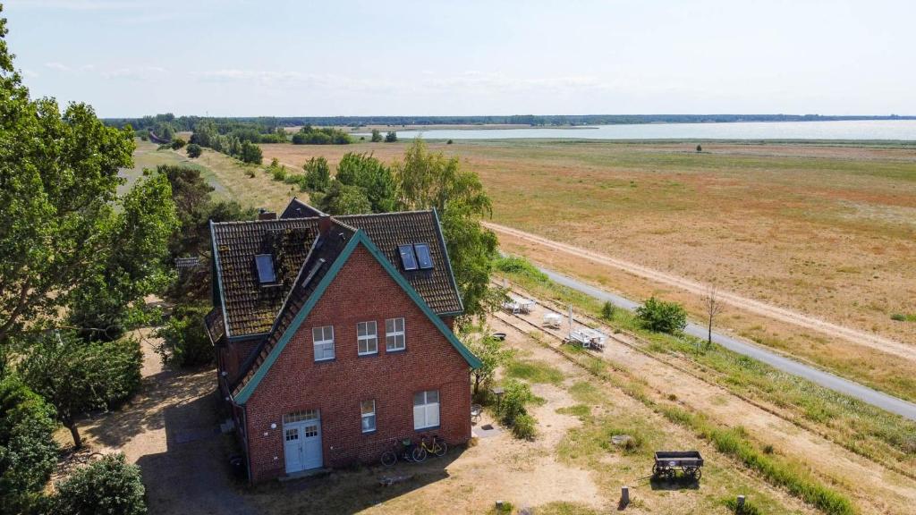 an aerial view of a house in a field at Alter Bahnhof Bresewitz in Bresewitz