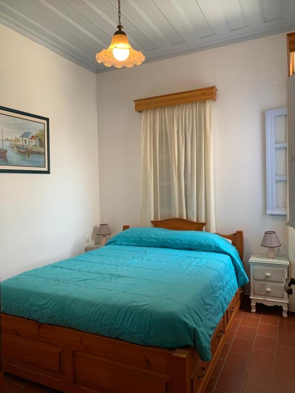 Postel nebo postele na pokoji v ubytování Patmos Maria Studios