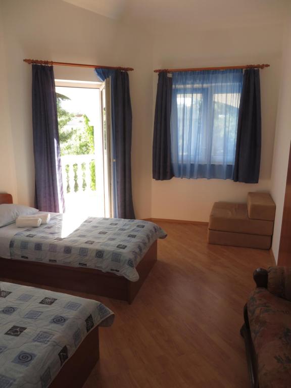 Posteľ alebo postele v izbe v ubytovaní Gardenia Apartments