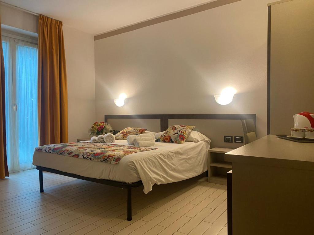 Postel nebo postele na pokoji v ubytování Hotel Lago di Como