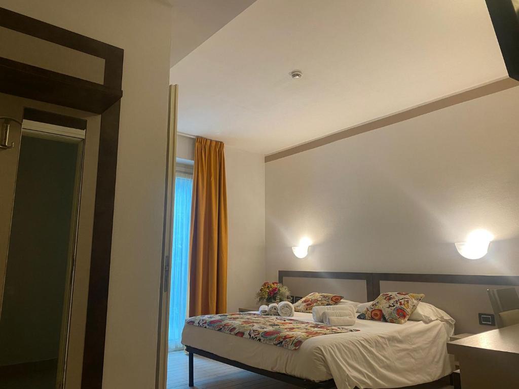 Postel nebo postele na pokoji v ubytování Hotel Lago di Como