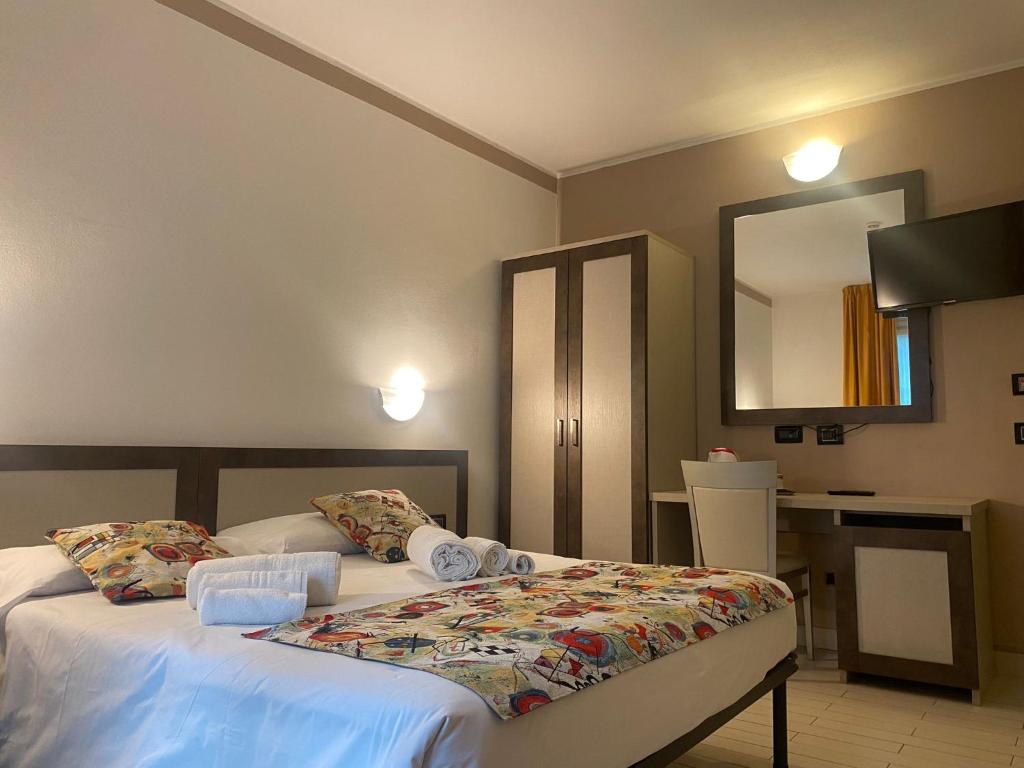 Postel nebo postele na pokoji v ubytování Hotel Lago di Como