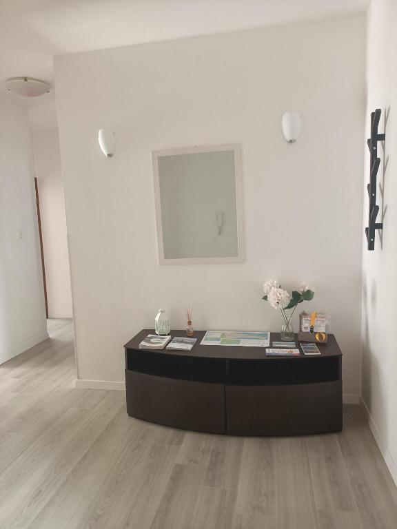 a table in a room with a white wall at Casa Mattei in Chioggia
