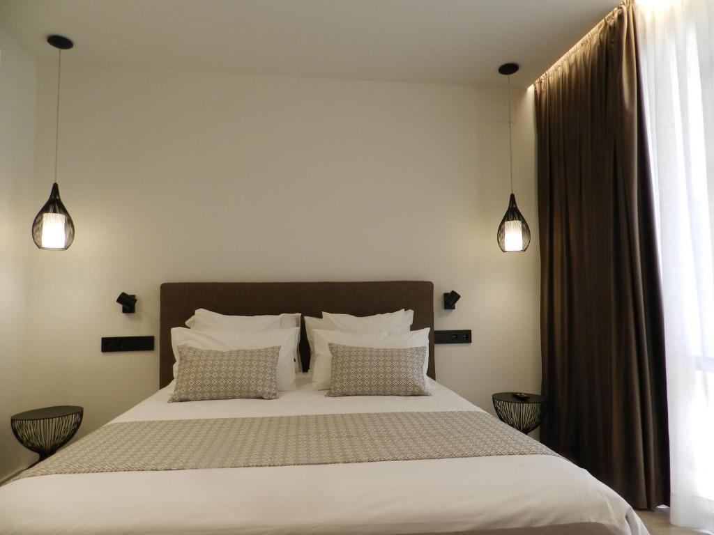 Postel nebo postele na pokoji v ubytování HOTEL MANEL