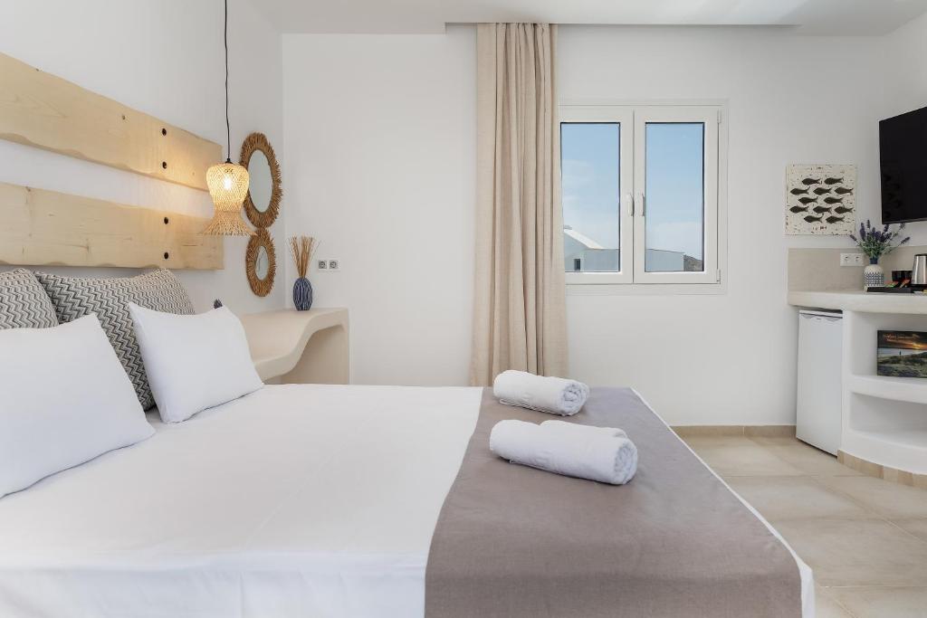 Postel nebo postele na pokoji v ubytování Naxos Leisure