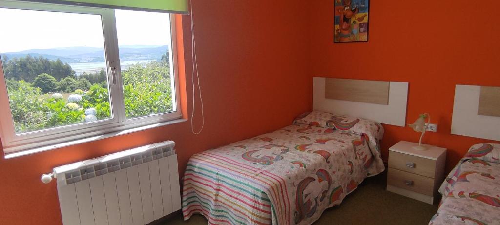 Postel nebo postele na pokoji v ubytování Casa Iris - Paraíso Ortegal