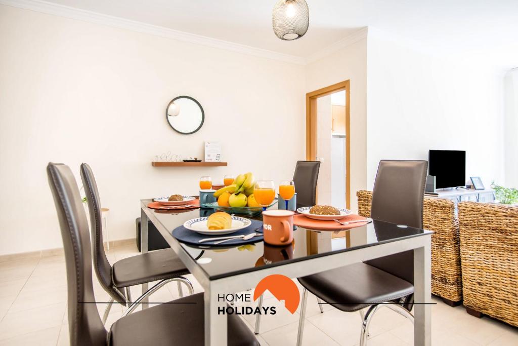 a dining room with a table with fruit on it at #055 São José V by Home Holidays in Branqueira