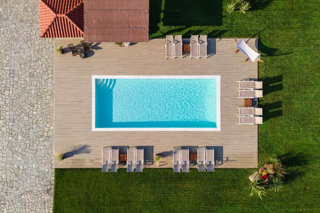 an overhead view of a swimming pool with chairs at Arteon Villas in Agios Nikolaos