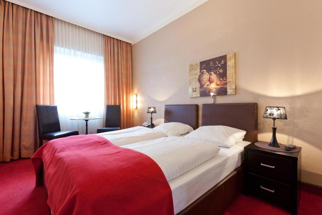 Ein Bett oder Betten in einem Zimmer der Unterkunft Hotel Imperial