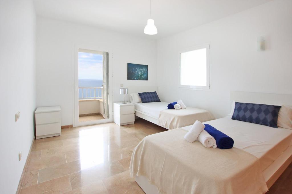 Postel nebo postele na pokoji v ubytování Villa Can Biel Canyamel by Slow Villas