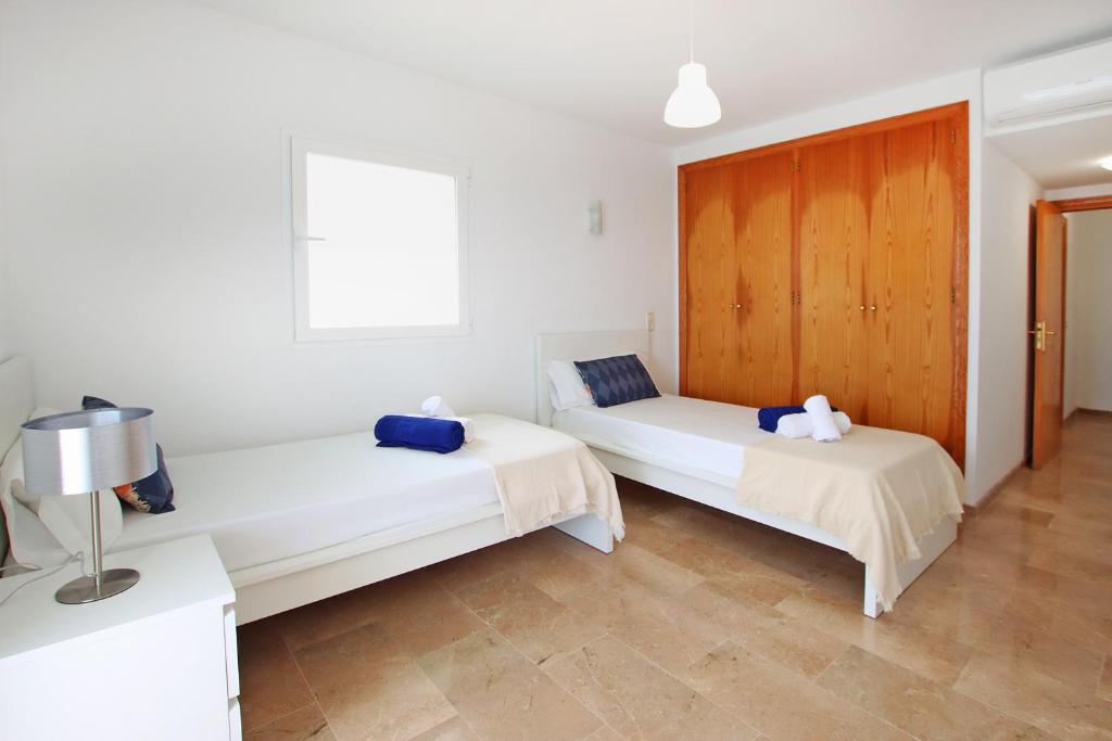 Postel nebo postele na pokoji v ubytování Villa Can Biel Canyamel by Slow Villas
