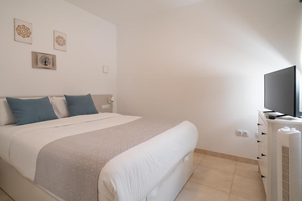 Posteľ alebo postele v izbe v ubytovaní Sabbia Suites Ginesa