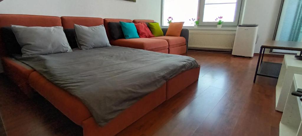 A bed or beds in a room at Juls Apartment next to football and hockey stadium