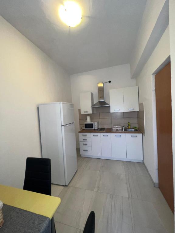 Kuchyň nebo kuchyňský kout v ubytování Apartments and pansion M&R