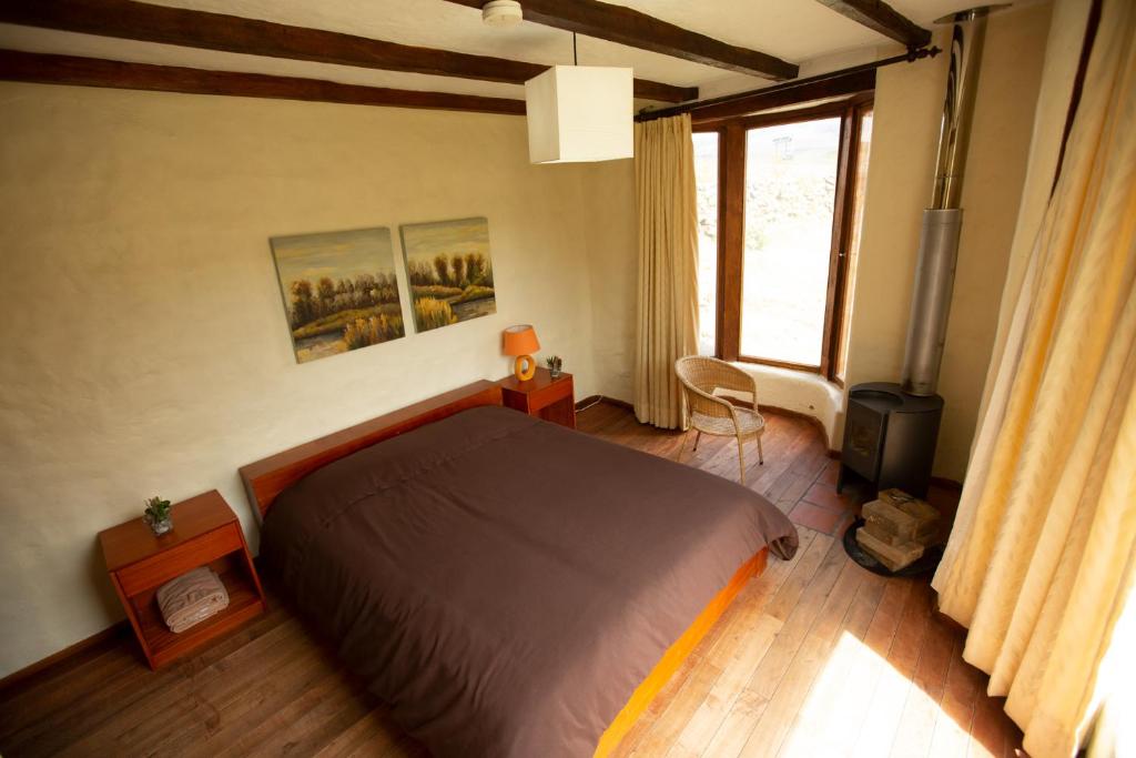 Postel nebo postele na pokoji v ubytování Hotel Tambopaxi