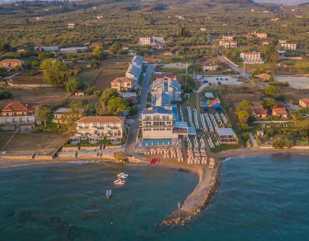an aerial view of a resort on a beach at Golden Coast Boutique - Luxury Living in Kypseli