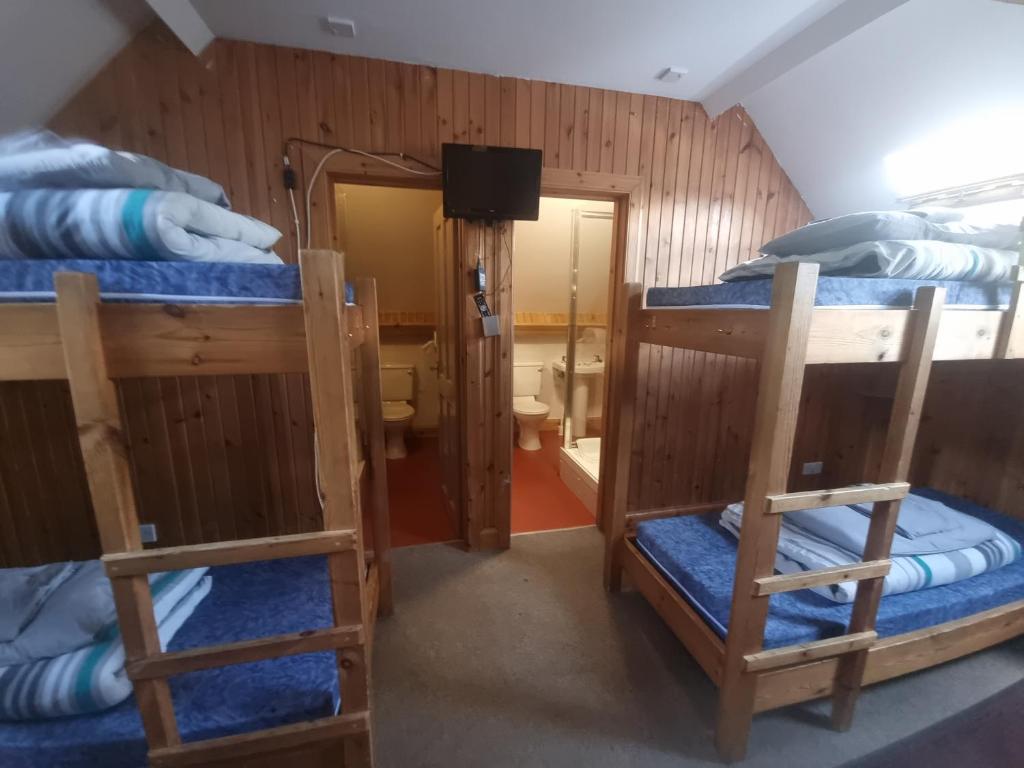 Postel nebo postele na pokoji v ubytování Blackwater Hostel