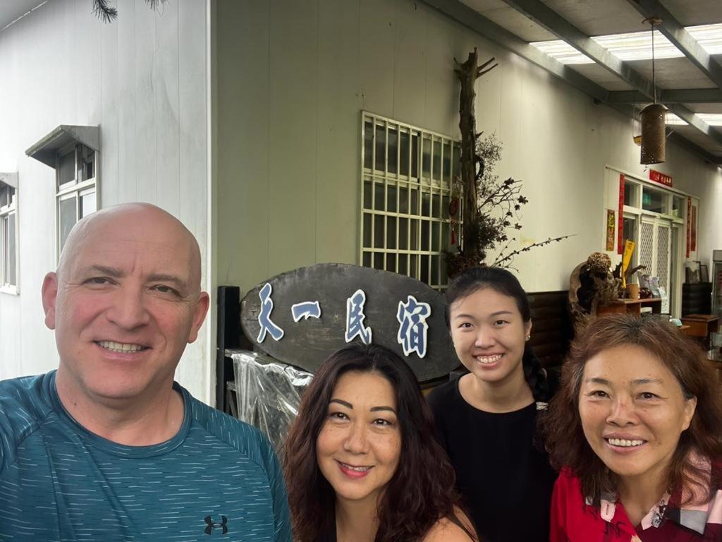 a group of people posing for a picture at Tianyi Homestay in Fenqihu