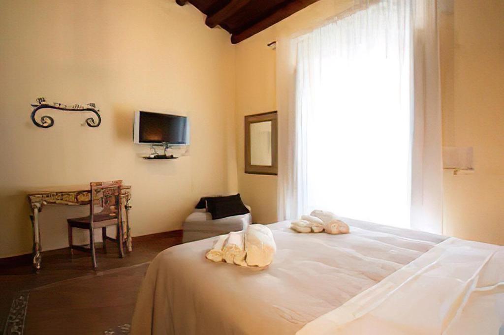 Postel nebo postele na pokoji v ubytování B&B Ares Charme
