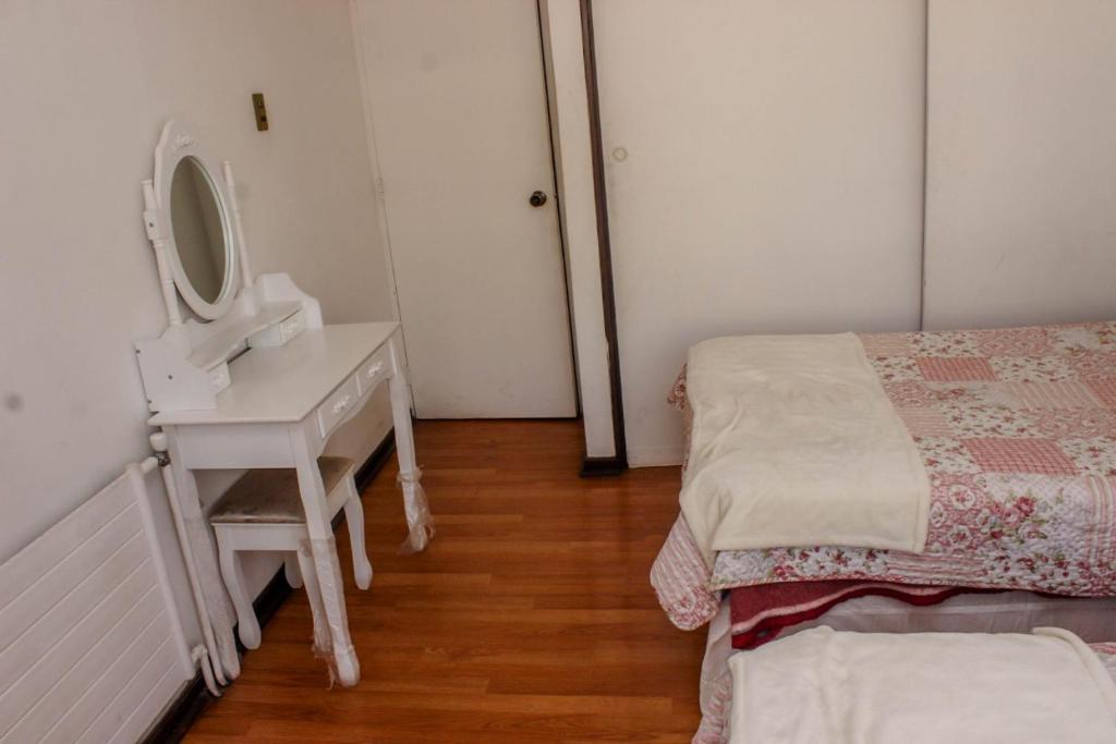 Postel nebo postele na pokoji v ubytování Departamentos Providencia J&M