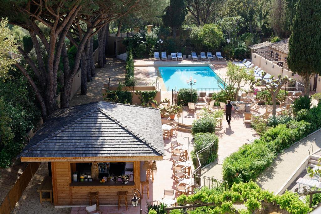 an overhead view of a resort with a swimming pool at La Ferme D'Augustin in Saint-Tropez