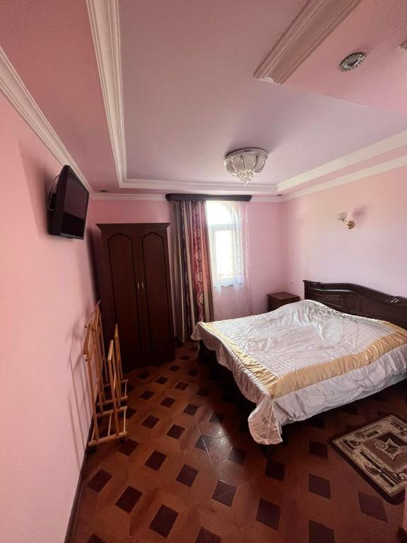Postel nebo postele na pokoji v ubytování Hotel Halidzor