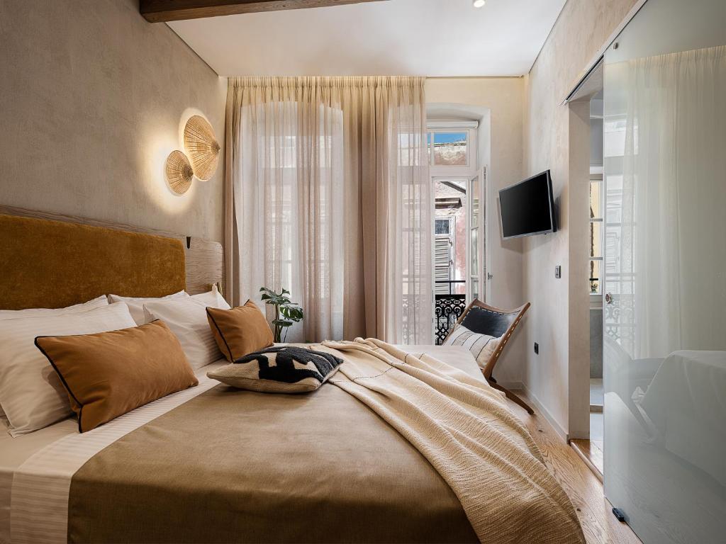 Postel nebo postele na pokoji v ubytování Casa Modiano Boutique