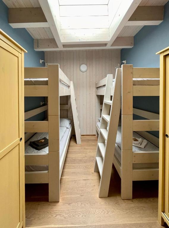 Postel nebo postele na pokoji v ubytování Apartmány Modřínový Dům