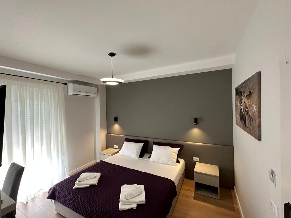Postel nebo postele na pokoji v ubytování Soin Rooms