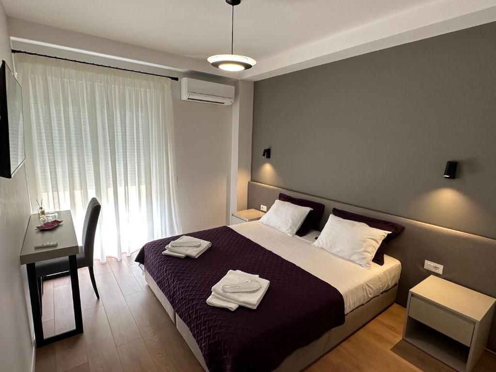Postel nebo postele na pokoji v ubytování Soin Rooms