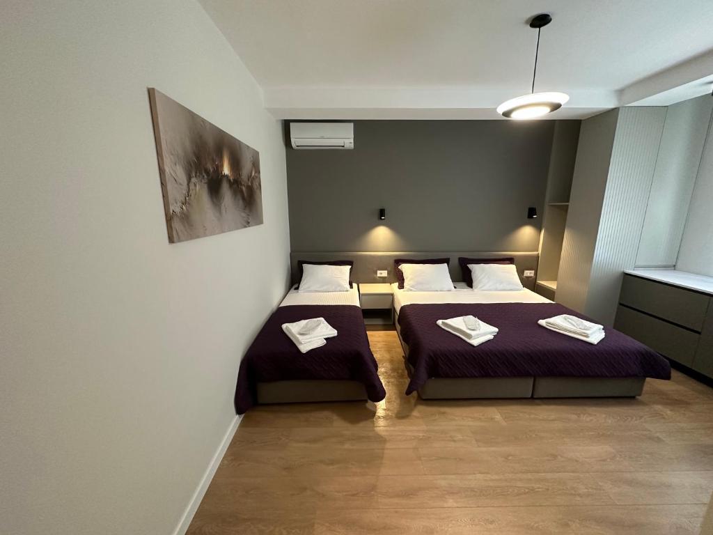 Postel nebo postele na pokoji v ubytování Soin Rooms