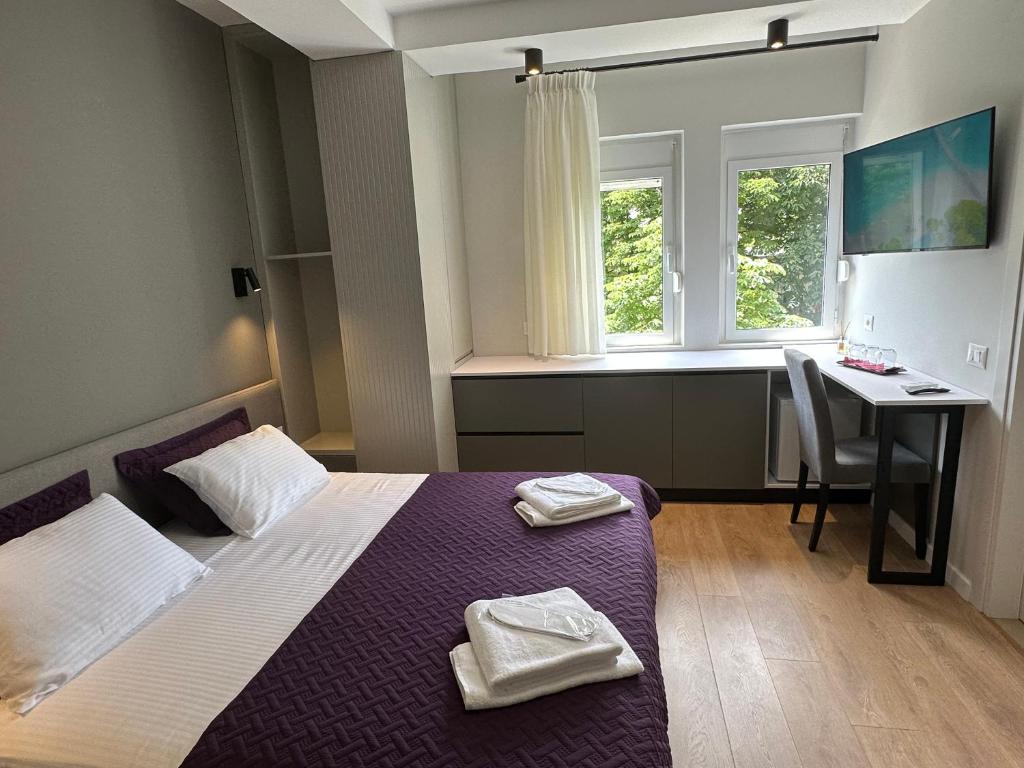 Postel nebo postele na pokoji v ubytování Soin Rooms