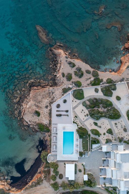 an aerial view of a building next to the ocean at Ambassador Luxury Villas in Santa Maria