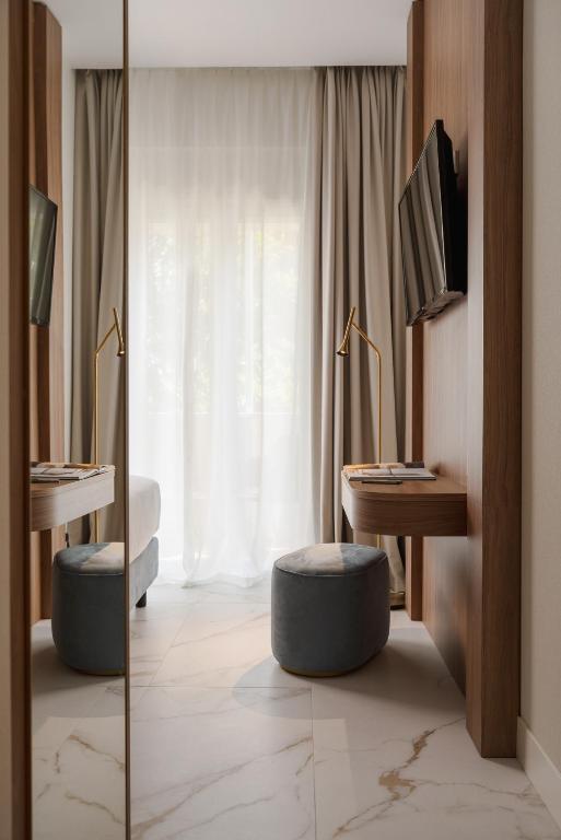 TV a/nebo společenská místnost v ubytování Parioli Hotel Rimini