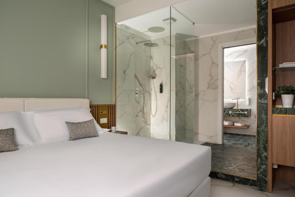 Postel nebo postele na pokoji v ubytování Parioli Hotel Rimini
