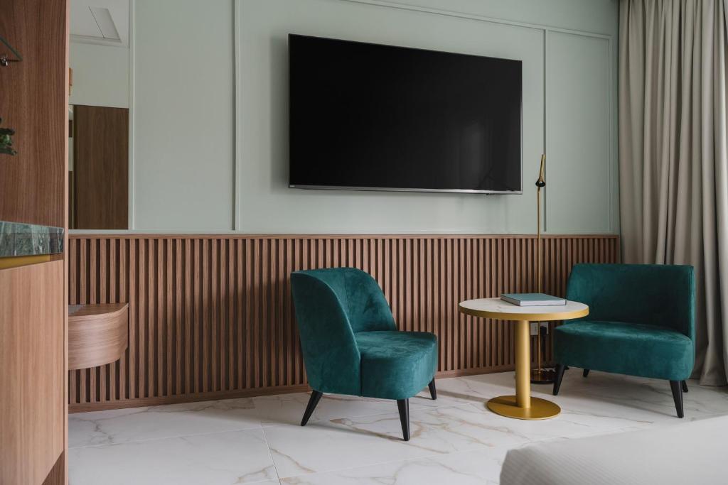 TV a/nebo společenská místnost v ubytování Parioli Hotel Rimini
