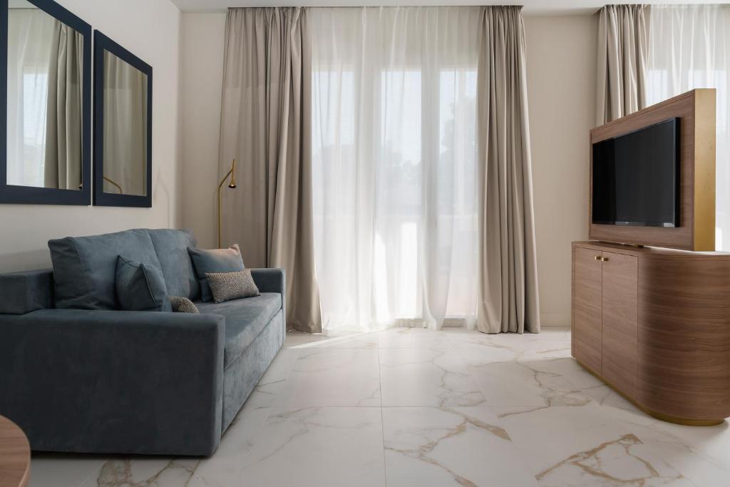 TV a/nebo společenská místnost v ubytování Parioli Hotel Rimini